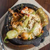 Molcajete · Grilled chicken, steak, or mix, sautéed with onions, tomatoes, and your choice of jalapeño, ...