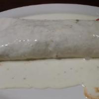 Burrito Del Mar · A 10 inch flour tortilla filled with grilled shrimp, and tilapia cooked with bell peppers, o...