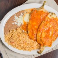 Chiles Poblanos · Two poblano peppers filled with Mexican cheese, covered with egg whites, topped with salsa r...