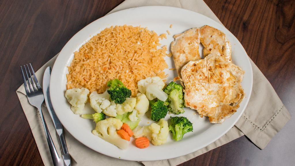 Pollo Ligero · Seasoned grilled chicken breast served with rice and steamed vegetables. Add cheese sauce for an additional charge.