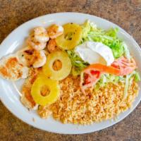 Pollo Real · Seasoned grilled chicken breast topped with sautéed shrimp, and pineapple, served with rice,...