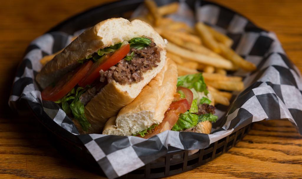 Signature Sub - Steak Burger · One of our most underrated menu items! A shaved sirloin & ground beef blend, topped with cheese, lettuce & tomato.