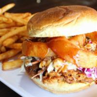 Sammie - Carolina Porker · Hand-pulled, oven-roasted pork cooked in one of our signature BBQ sauces, topped with colesl...