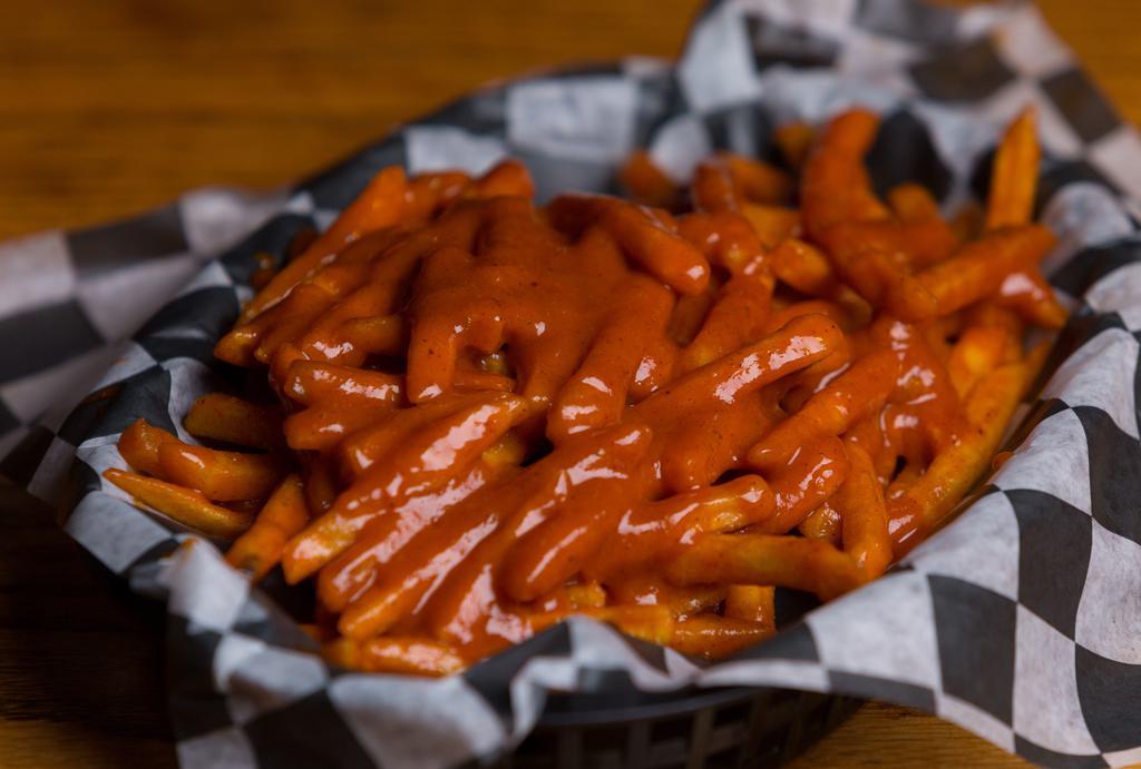 Poor Man'S Wings · Crispy Fries tossed in your choice of sauce or rub. Perfect for a bite on a budget!Disclaimer - These are NOT chicken wings, they're French fries.