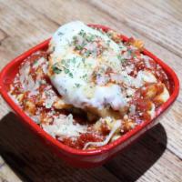 Chicken Parm Mac · Our housemade Mac 'n Cheese topped with breaded chicken, house marinara & shredded parmesan ...