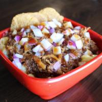 Porky'S Mac · Hand-pulled, oven-roasted pulled pork cooked in your choice of sauce, topped with red onion