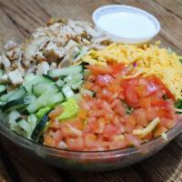 Steph'S Salad · Fresh cucumbers, tomatoes, cheddar cheese and oven roasted turkey, finely chopped atop a bed...