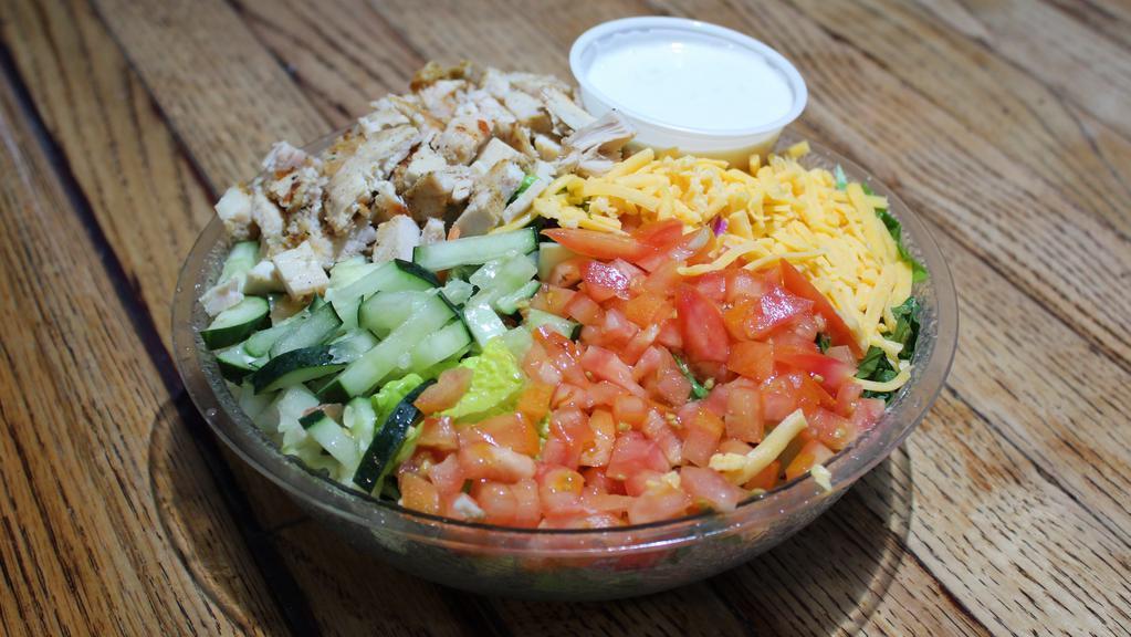 Steph'S Salad · Fresh cucumbers, tomatoes, cheddar cheese and oven roasted turkey, finely chopped atop a bed of house greens and served with the dressing of your choice.