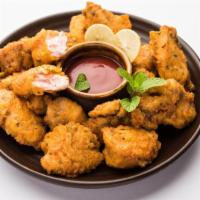 Chicken Pakora · Chunks of boneless chicken marinated in spicy sauce then fried, served with tamarind sauce a...