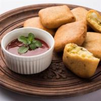 Cheese Pakora · Delicious homemade cheese and vegetable fritter with tamarind and onion chutney.