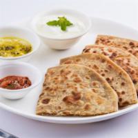 Aloo Naan · Unleavened bread with potatoes and butter baked in a clay oven.