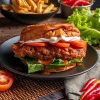 The Nashville Hot Chicken Tender Sandwich · Delicious sandwich made with spicy, seasoned chicken tenders with mayonnaise, ketchup, shred...