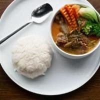 Panang Curry · Gluten-free, spicy. Coconut milk, red bell pepper served with steamed vegetables.