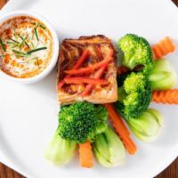 Chu Chee Grilled Salmon · Gluten-free, spicy. Atlantic salmon, chu chee curry sauce, steamed vegetables.