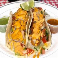 Shrimp Taco (Corn Tortilla) · Grilled shrimp and topped with grated cheese, lettuce, pico de gallo and our homemade chipot...