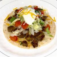 Soft Taco (Flour Tortilla) · Choice of meat. Topped  with grated cheese, lettuce, sour cream, and pico de Gallo. Goes wit...
