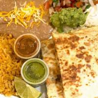Quesadilla Plate · Quesadillas are stuffed with cheese and choice of meat.  Goes with sides of refried beans, r...