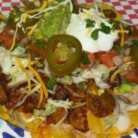 Nachos Supreme · Our fresh homemade Nachos are topped with choice of meat, re-fried beans, cheese dip, lettuc...