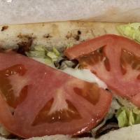 Philly Sandwich · Our phillys come loaded with green peppers, onions, lettuce, tomato, mayo and mozzarella che...