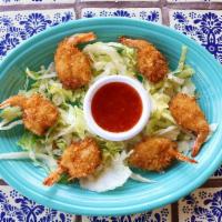 Camarones De Coco · Six coconut shrimp fried to the perfect crunch, served with a side of delicious sweet chili ...