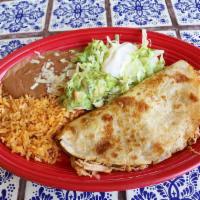 Quesadilla Special · Grilled flour tortilla stuffed with shredded chicken or ground beef, topped with lettuce, so...