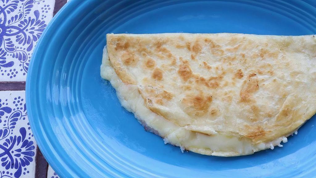 Cheese Quesadilla · A grilled flour tortilla filled with melted cheese.