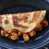 Shrimp Quesadilla · A grilled flour tortilla filled with melted cheese and savory shrimp.