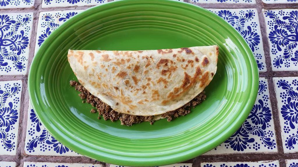 Shredded Chicken Or Chunk Beef Quesadilla · A grilled flour tortilla filled with melted cheese and your choice of our juicy shredded chicken, fresh ground beef, delicious chunk beef, or homemade chorizo.