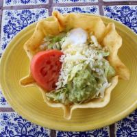 Taco Salad · Crispy taco bowl shell filled with your choice of juicy shredded chicken, fresh ground beef,...