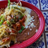 Fajita Burrito · Flour tortilla filled with your choice of grilled chicken or tender grilled steak topped wit...