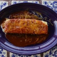 Enchilada · A traditional enchilada made of a rolled corn tortilla filled with your choice of juicy shre...