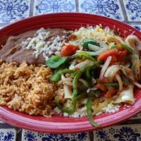 Enchiladas Ranchero · Three delicious rolled corn tortillas stuffed with our finely grated white cheese melted to ...