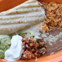 Chimichanga La Fuente · Our largest flour tortilla filled with your choice of chunk beef or shredded chicken, deep f...
