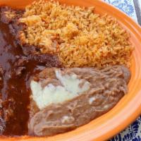 Chile Colorado · A spicy traditional dish of tender beef chunks covered in a secret red chili sauce, served w...