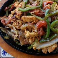Lunch Fajitas · Tender strips of marinated chicken breast, beef skirt steak, or a mix of the two, cooked wit...