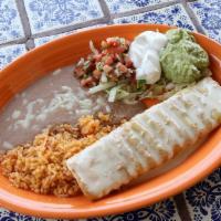 Lunch Chimichangas · Flour tortilla filled with your choice of tender chunk beef or shredded chicken, deep fried ...