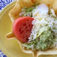 Lunch Taco Salad · Crispy taco bowl shell filled with your choice of juicy shredded chicken, fresh ground beef,...