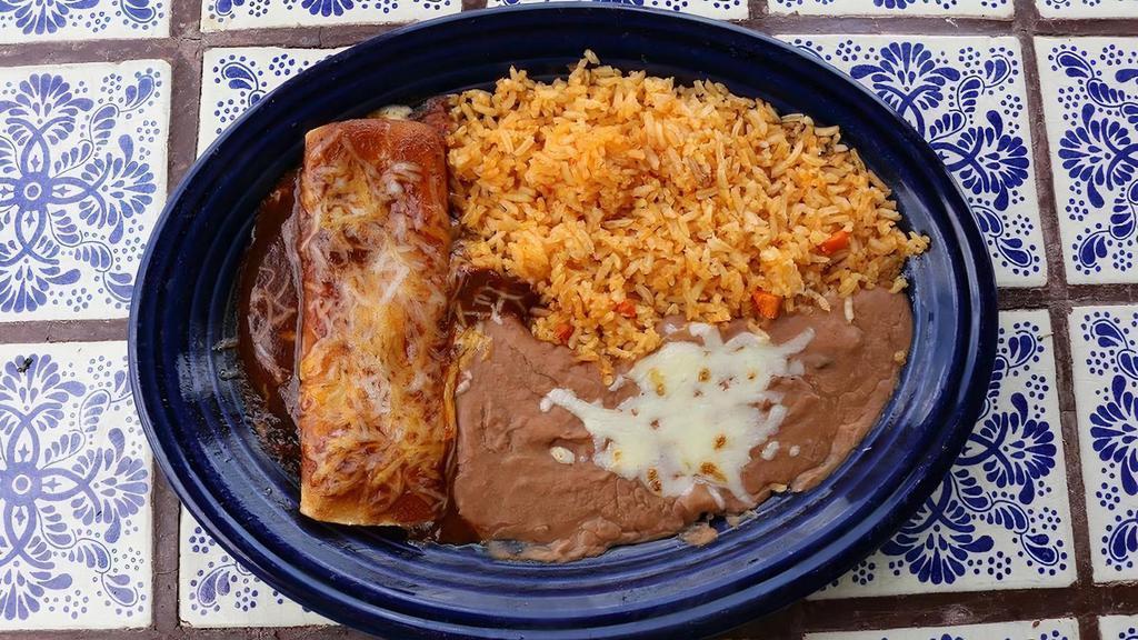 Lunch Enchilada · A traditional enchilada with your choice of juicy shredded chicken, fresh ground beef, or melted cheese with a side of fresh rice and homemade refried beans.