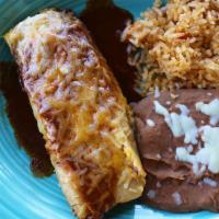 Lunch Tamale · A traditional tamale filled with shredded beef topped with our delicious red sauce and shred...