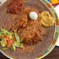 #11. Tsebhi Derho · Served with two choices of vegetables alitcha, timtimo or hamley with 1 injera. Chicken and ...