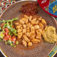 #10. Chicken · Served with two choices of vegetables alitcha, timtimo or hamley with 1 injera. Chicken cube...