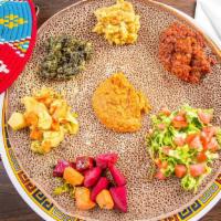 #13. Alitcha · Served with two choices of vegetables alitcha, timtimo or hamley with 1 injera. Variety vege...
