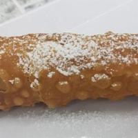 Cannoli · Sweetened ricotta cream filled pastries with chocolate chips and a dusting of powdered sugar...