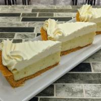 Key Lime Pie · Our signature filling made with fresh juice and zest baked in a graham cracker crust, topped...