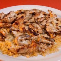 Arroz Con Pollo · Grilled chicken strips on a bed of rice covered in cheese sauce