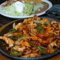 La Parrilla Fajitas · Grilled onions, bell peppers, tomatoes, chicken or steak Served with rice & beans, lettuce, ...