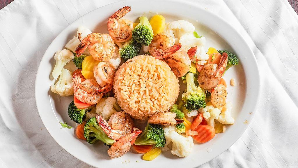 Mixed Vegetable Plate · Grilled Chicken or Shrimp served with carrots, cauliflower, broccoli. Served with rice and a cup of
cheese sauce