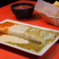 Burrito Grande · Flour tortilla stuffed with rice & beans, Shredded Chicken or Ground Beef. Served with pico ...