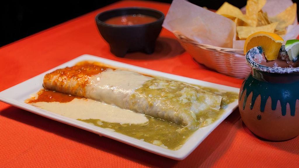 Burrito Grande · Flour tortilla stuffed with rice & beans, Shredded Chicken or Ground Beef. Served with pico de gallo and sour cream