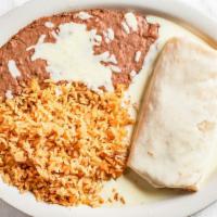 La Parrilla Burrito · Flour tortilla stuffed with onions, bell peppers, and tomatoes, and covered with queso. Serv...